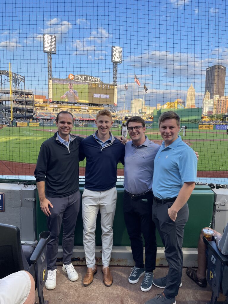 group of men taking a picture in front of home plate at a game