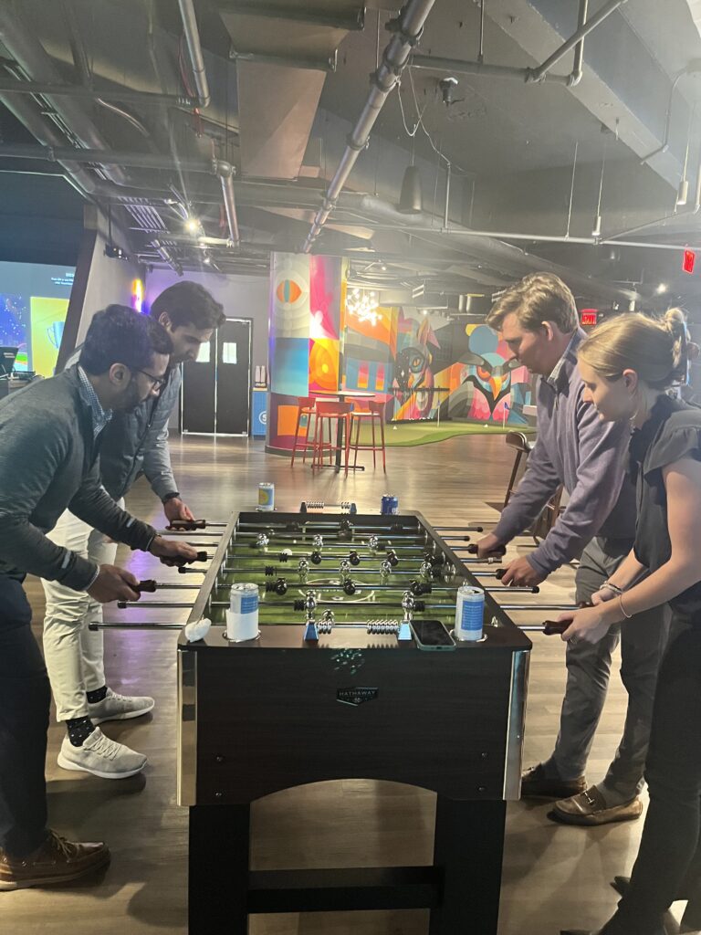 Team Playing Foosball